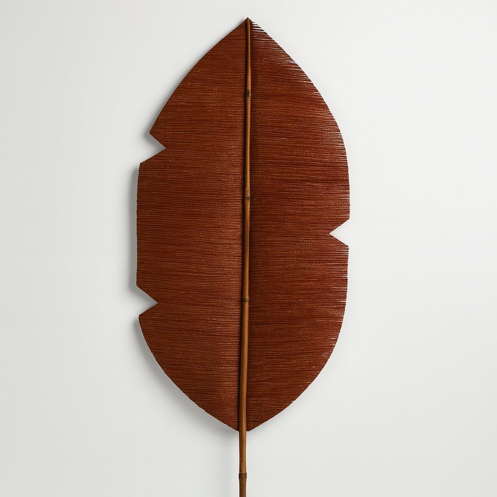 Brown leaf-shaped decorative item on a white background