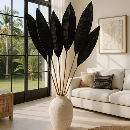 Decorative plant in a vase on a coffee table in a living room with a large window.