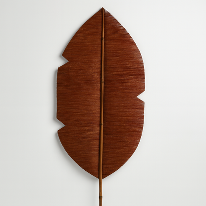 Brown leaf-shaped decorative item on a white background